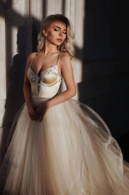 A-Line Spaghetti Straps Sweep Train Wedding Dress With Beading